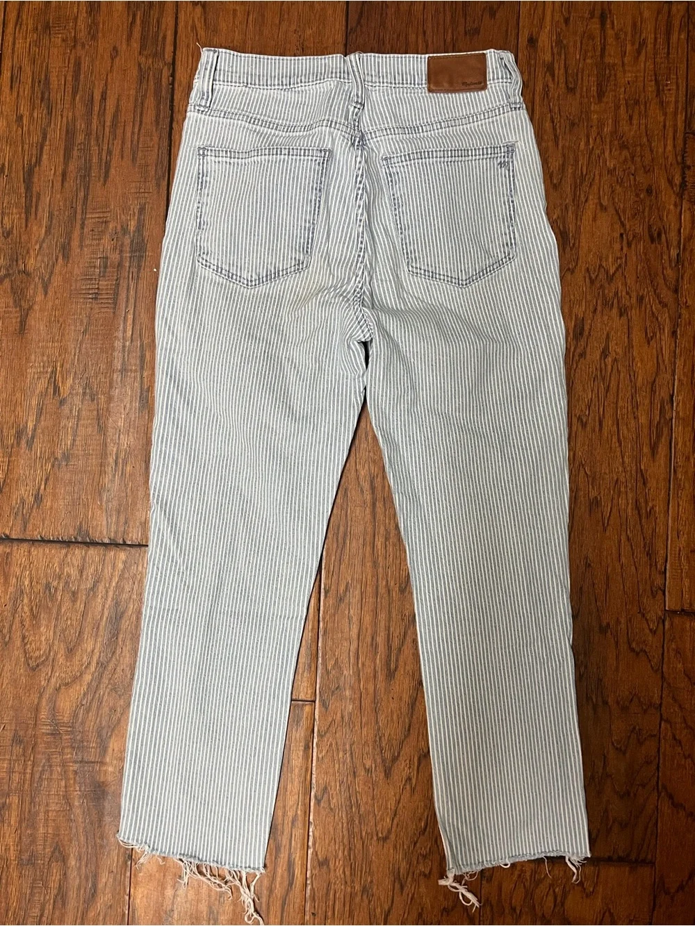 Madewell railroad striped 10” high rise skinny crop jeans with raw hem
